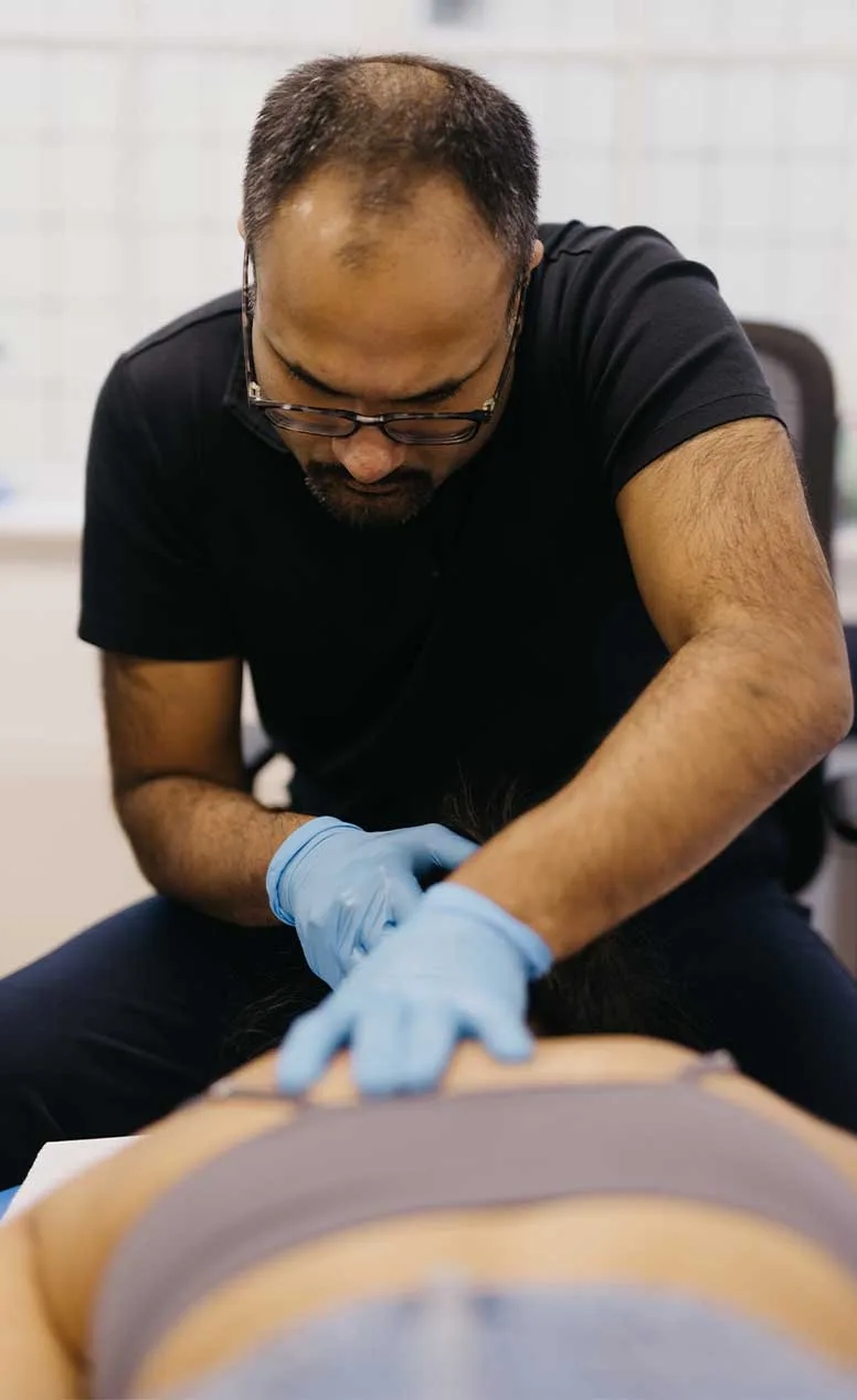 Rishi Patel treating a patient